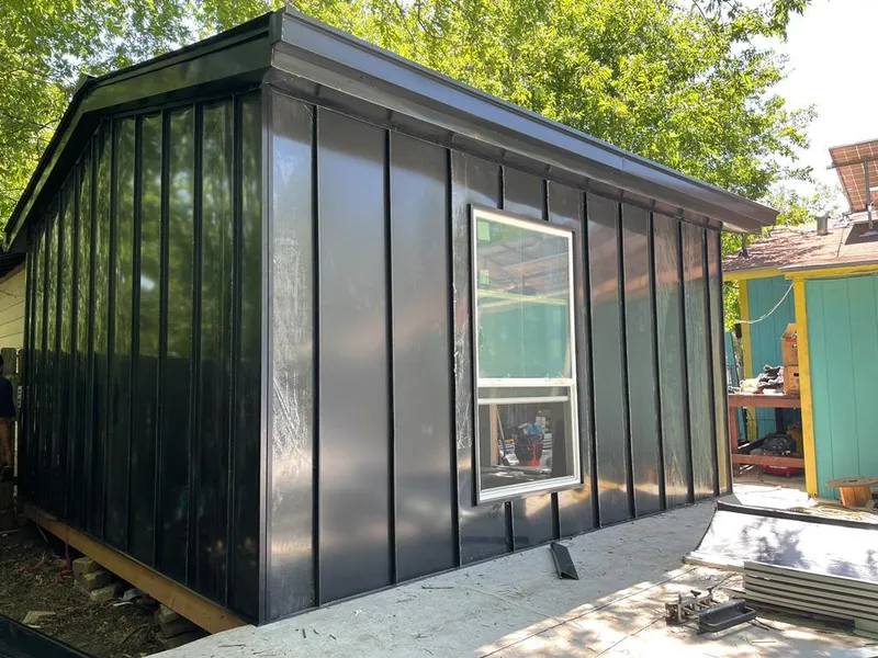 Black standing seam metal wall panels for Roof Inspection in Southeast