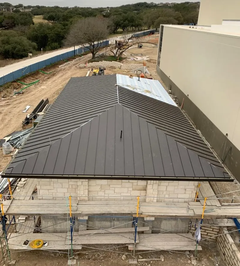 Metal roof new construction with scaffolding in Southeast